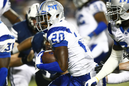 Chris Detrick  |  The Salt Lake Tribune
Middle Tennessee Blue Raiders safety Kevin Byard (20) runs past Brigham Young Cougars wide receiver JD Falslev (12) after intercepting the ball during the second half of the game at LaVell Edwards Stadium Friday September 27, 2013.